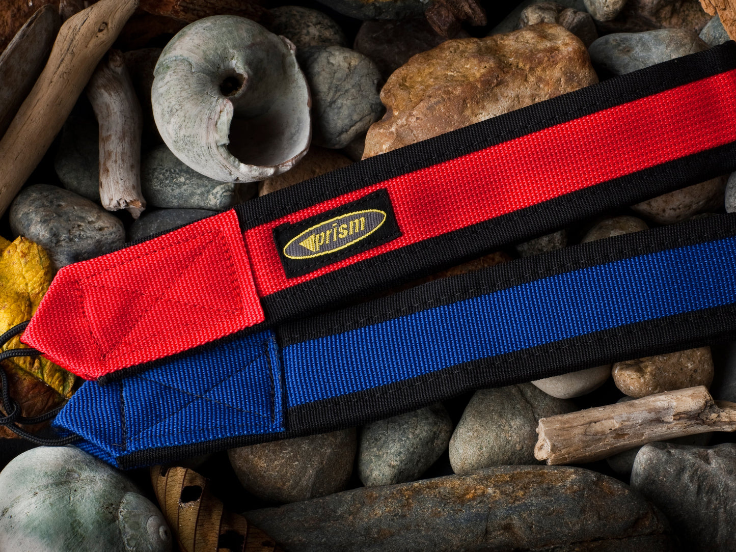 Padded wrist straps on pebbly beach