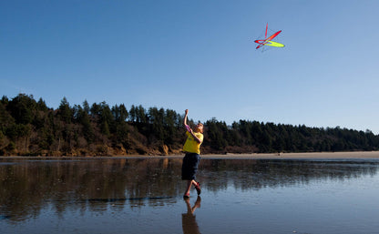 Boy playing with EO Atom fire on the beach